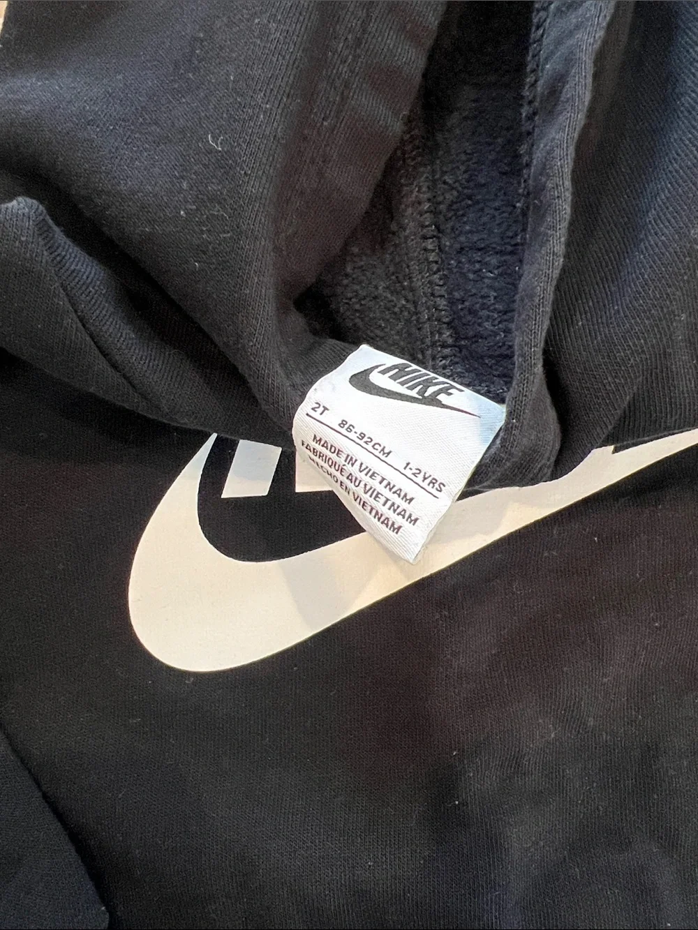 Nike Kids Black Hoodie with White Swoosh Logo